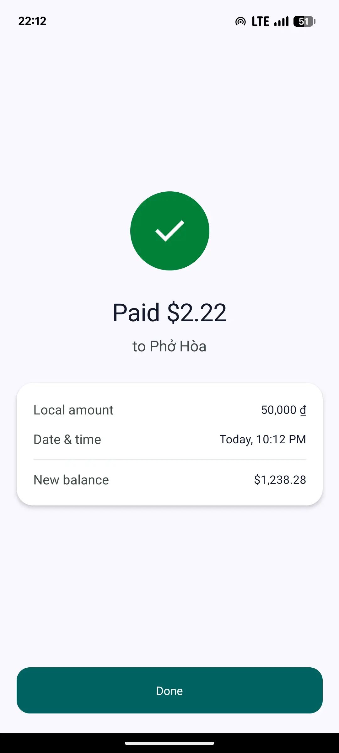 Valuto payment confirmed screen: paid $2.22 to Phở Hòa, with the local amount and new balance